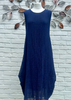 This sleeveless maxi dress is made from a navy sheer fabric with a beautiful all over swirl design, with a soft viscose lining.  The dress has a hitch up hem on both sides, which can be buttoned up or let down for a longer length look. Perfect for any spring summer occasion, from a wedding - mother of the bride, mother of the groom and wedding guest to everyday wear.  This dress will take you from day to night with effortless style and elegance.