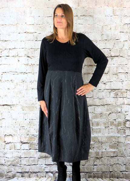 The 8 Panel Dress is made from a soft black cotton fabric with a marble effect skirt and jersey top. Perfect for any autumn / winter occasion from a wedding, mother of the bride, mother of the groom to a party or everyday wear. This dress will take you from day to night with effortless style and elegance.