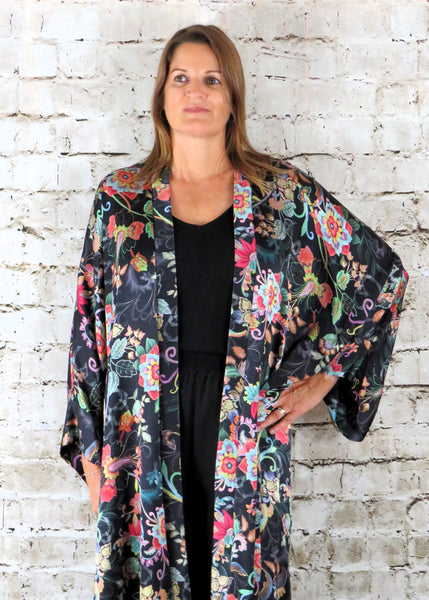 This long kimono is made from a vegan habotai, with a beautiful brightly coloured flower design. Perfect for any autumn winter occasion, from a wedding to a party and everyday wear. This kimono will take you from day to night with effortless style and elegance.