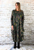 This hitch up dress is made from a soft feel forest Jersey fabric, with an all over green and grey woodland print. The dress has a hitch up hem on both sides, which can be buttoned up or let down for a longer length. Perfect for any autumn / winter occasion from a wedding, mother of the bride, mother of the groom to a party or everyday wear. This dress will take you from day to night with effortless style and elegance. Available in Black, Forest, Navy and Olive.