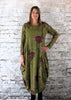 This hitch up dress is made from a soft feel olive Jersey fabric, with an all over green and red woodland print. The dress has a hitch up hem on both sides, which can be buttoned up or let down for a longer length. Perfect for any autumn / winter occasion from a wedding, mother of the bride, mother of the groom to a party or everyday wear. This dress will take you from day to night with effortless style and elegance. Available in Black, Forest, Navy and Olive.