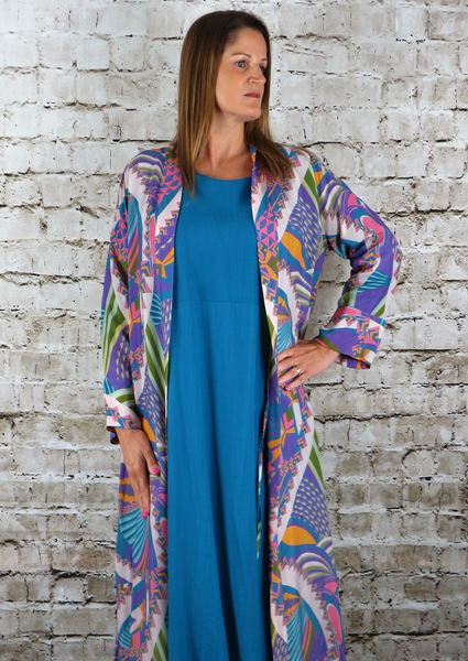 The Kimono is made from a soft teal cupro fabric with a beautiful all over abstract print. Perfect for any spring summer occasion, from a wedding to any celebration to everyday wear. This kimono will take you from day to night with effortless style and elegance.