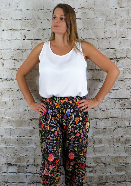 The trousers are made from a soft black cotton fabric, with a beautiful all over flower print in spring summer colours. Perfect for any occasion, wedding, party or everyday. These trousers will take you from day to night with effortless style and elegance.