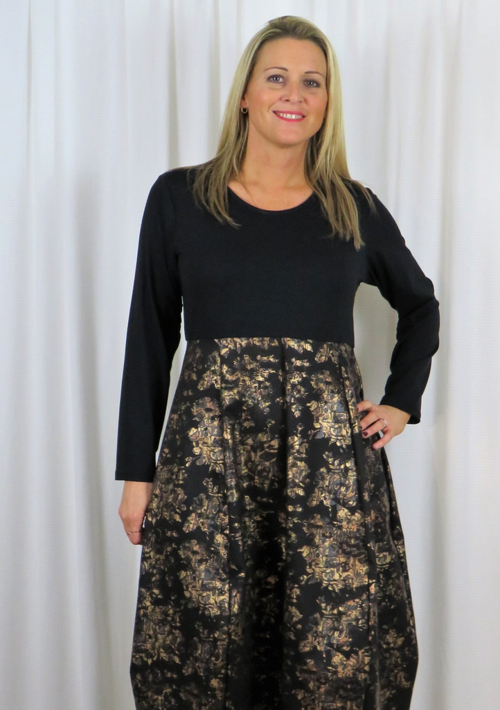 This dress is made from a soft cotton printed black and gold fabric with a Jersey top. Perfect for any autumn winter occasion, from a wedding - Mother of the Bride, Mother of the Groom, Wedding Guest to a party or everyday wear. This dress will take you from day to night with effortless style and elegance.