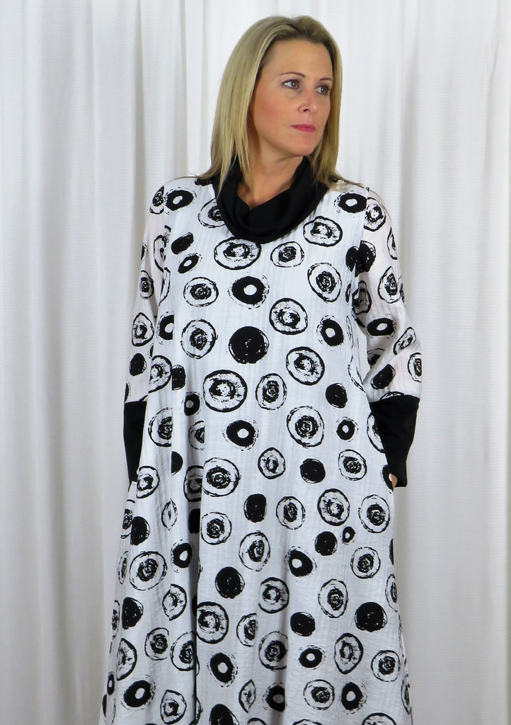 This Cowl Pocket Dress is made from a Viscose fabric with a Jersey cowl and sleeve, with a beautiful all over white and black design. Perfect for any autumn winter occasion, from a wedding - Mother of the Bride, Mother of the Groom, Wedding Guest to a party or everyday wear. This dress will take you from day to night with effortless style and elegance.