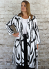 This coat dress is made from a soft white linen, with a beautiful all over abstract print. It can be worn buttoned up as a beautiful dress, or unbuttoned over your favourite outfit. Perfect for any spring summer occasion, from a wedding to any celebration to everyday wear. This coat dress will take you from day to night with effortless style and elegance.