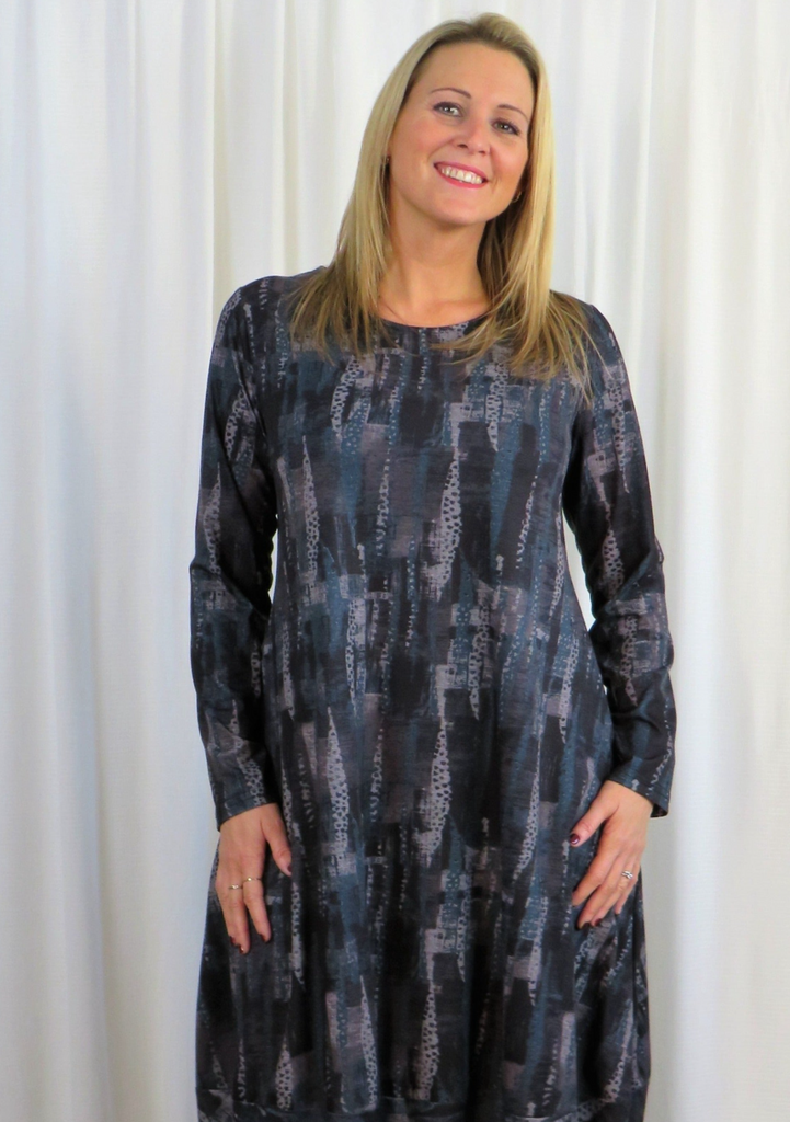 This dress is made from a soft feel black jersey fabric with a beautiful, all over sage waterfall print. Perfect for any autumn winter occasion, from a wedding to a party and everyday wear. This dress will take you from day to night with effortless style and elegance.