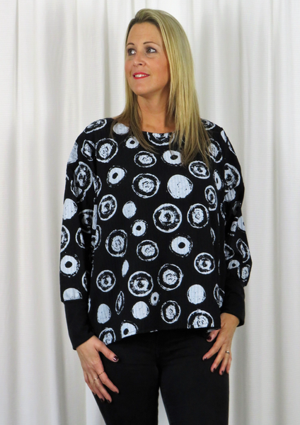 The Wide Top is made from a soft black viscose fabric with a beautiful all over white circle print. Perfect for any autumn winter occasion or everyday wear. This top will take you from day to night with effortless style and elegance.