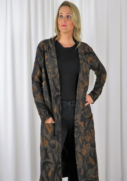 The Cardi Coat is made from a soft knitted cotton jacquard fabric. With an all over gold and black autumnal design. Perfect for any autumn winter occasion, from a wedding to a party and everyday wear. This cardi coat will take you from day to night with effortless style and elegance.