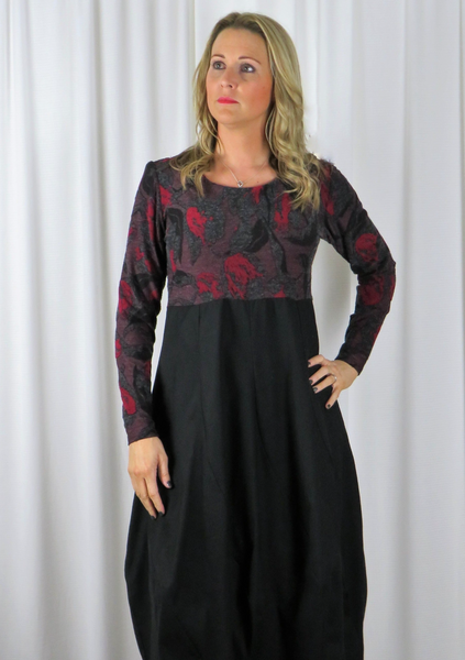 The spiral dress is made from a soft knitted cotton jacquard fabric in a port and black autumnal design with a black cotton skirt. Perfect for any autumn winter occasion, from a wedding to a party and everyday wear. This dress will take you from day to night with effortless style and elegance.