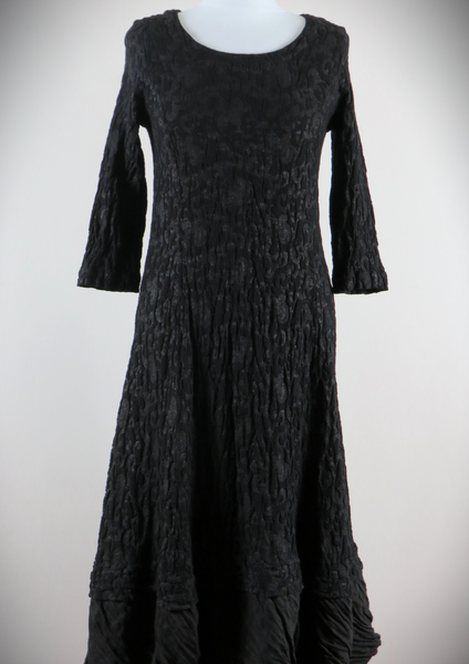 This maxi dress is made from a luxurious soft stretch black metallic jacquard with a soft satin frill. Perfect for any autumn winter occasion, from a wedding Mother of the Bride, Mother of the Groom, Wedding Guest to a party or everyday wear. This maxi dress will take you from day to night with effortless style and elegance.