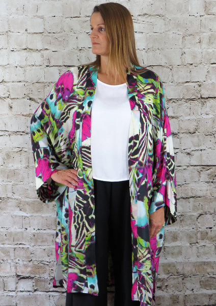 This long kimono is made from a soft Cupro habotai, with a beautiful brightly coloured design. Perfect for any spring summer occasion, from a wedding to a party and everyday wear. This kimono will take you from day to night with effortless style and elegance.