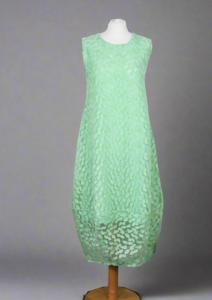 This sleeveless dress is made from a beautiful green leaf embroidery with a viscose lining. Perfect for any spring summer occasion, from a wedding - mother of the bride, mother of the groom and wedding guest to a party and everyday wear. This dress will take you from day to night with effortless style and elegance.