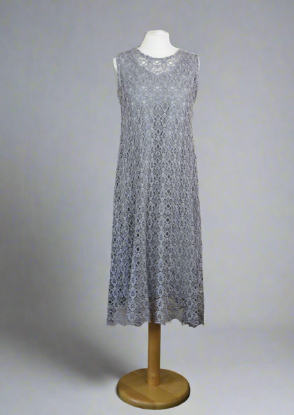 This dress is made from beautiful silver lace macramè with a separate viscose lining. Perfect for any spring summer occasion, from a wedding - mother of the bride, mother of the groom and wedding guest to everyday wear.  This dress will take you from day to night with effortless style and elegance.