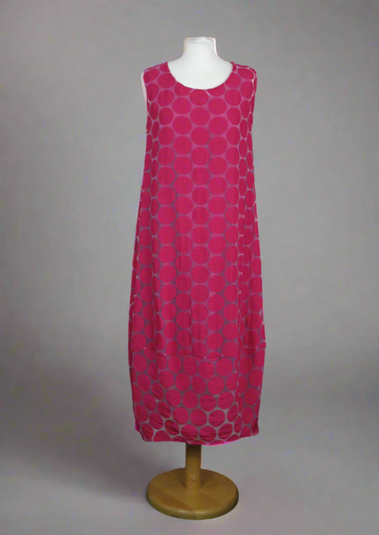 This sleeveless dress is made from a cerise sheer fabric with a beautiful all over spot design, and a soft viscose lining. Perfect for any spring summer occasion, from a wedding - mother of the bride, mother of the groom and wedding guest to everyday wear. This dress will take you from day to night with effortless style and elegance. A matching shrug is available