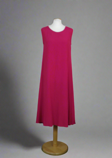 This sleeveless dress is made from a soft cerise crepe fabric. Perfect for any spring summer occasion, from a wedding - mother of the bride, mother of the groom and wedding guest to everyday wear. This dress will take you from day to night with effortless style and elegance. A matching shrug is available.