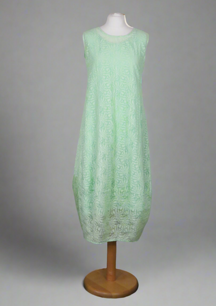 This sleeveless dress is made from a green sheer fabric with a beautiful all over shell design, and a soft viscose lining. Perfect for any spring summer occasion, from a wedding - mother of the bride, mother of the groom and wedding guest to everyday wear. This dress will take you from day to night with effortless style and elegance. A matching shrug is available.