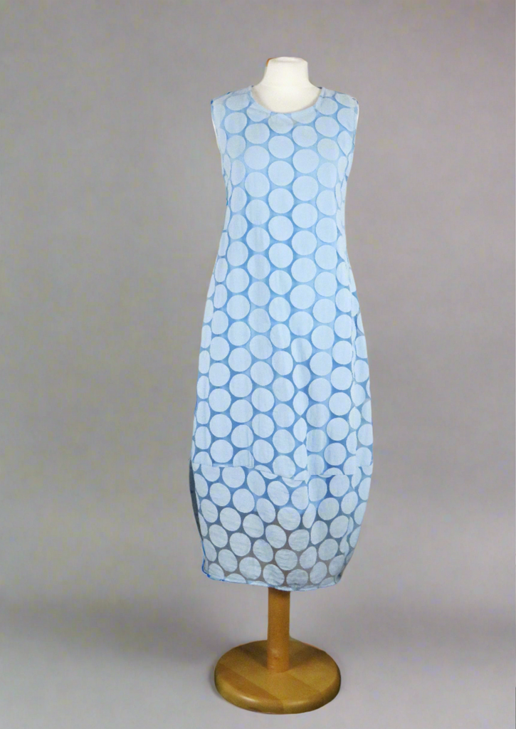 This sleeveless dress is made from a blue sheer fabric with a beautiful all over spot design, and a soft viscose lining. Perfect for any spring summer occasion, from a wedding - mother of the bride, mother of the groom and wedding guest to everyday wear. This dress will take you from day to night with effortless style and elegance. A matching shrug is available.
