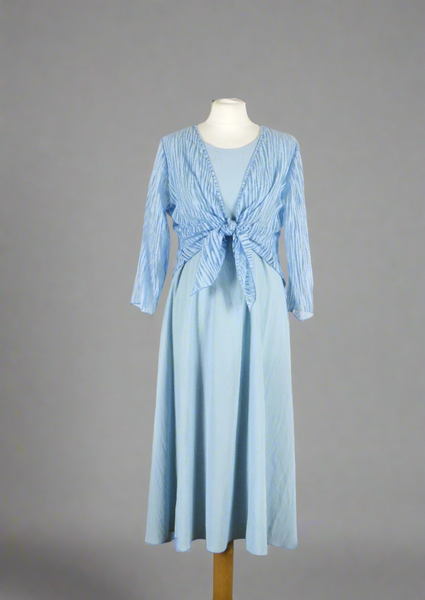 The shrug is made from a soft sheer blue fabric with a beautiful stripe design. Perfect for any spring summer occasion, from a wedding - mother of the bride, mother of the groom and wedding guest to everyday wear. This shrug will take you from day to night with effortless style and elegance. Matching dresses available.