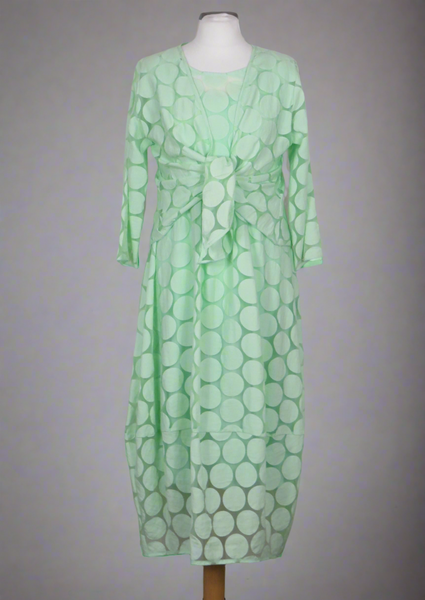 The shrug is made from a soft sheer green fabric with a beautiful spot design. Perfect for any spring summer occasion, from a wedding - mother of the bride, mother of the groom and wedding guest to everyday wear. This shrug will take you from day to night with effortless style and elegance. Matching dresses available.