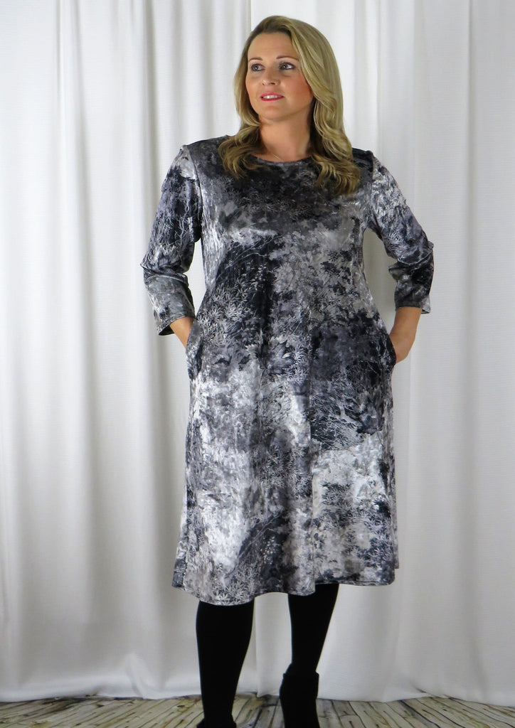 This dress is made from a soft stretch viscose velvet fabric, with a beautiful all over silver autumnal design. Perfect for any autumn winter occasion, from a wedding Mother of the Bride, Mother of the Groom, Wedding Guest to a party or everyday wear. This dress will take you from day to night with effortless style and elegance.