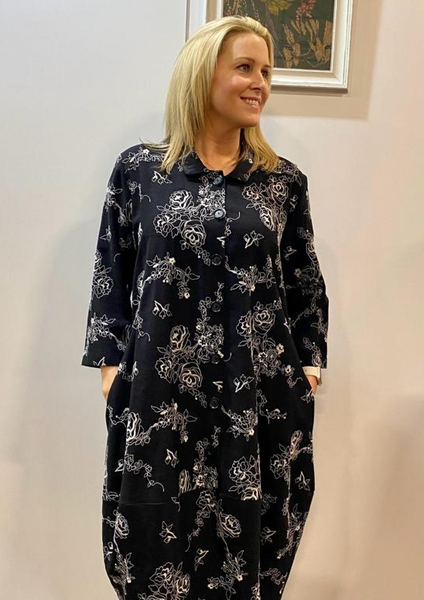 This button front dress is made from a soft black fabric, with a beautiful all over flower design. Perfect for any occasion, or everyday wear. This dress will take you from day to night with effortless style and elegance.