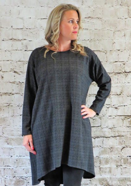 The wide tunic is made from a soft stretch grey cotton knitted fabric, with a beautiful all over check design. Perfect for any autumn winter occasion or everyday wear. This top will take you from day to night with effortless style and elegance.